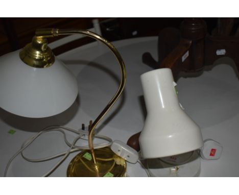 A white angle light and similar brass glass shade desk lamp