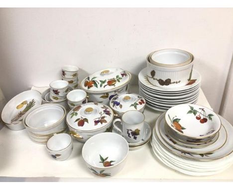 A collection of Royal Worcester china in Eversham and similar patterns including casserole dishes, souffle dishes, ramekins, 