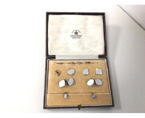 A set of 8ct and 9ct gold engine turned sleevelinks and studs, retailed by Mappin &amp; Webb, in original presentation box, m