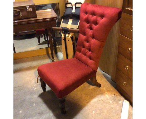 An Edwardian slipper chair in later button back brick red upholstery, on turned front supports ending in castors (88cm x 52cm