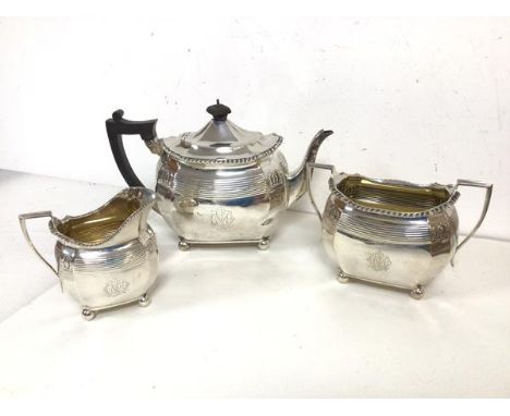 A Victorian London silver tea service including teapot, milk jug and sugar bowl, all with gadroon edge anthemions to corners 