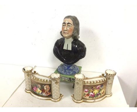 A 19thc. ceramic bust of the Reverend Wesley, on footed base, some losses and damage (29cm) and a pair of Staffordshire vases