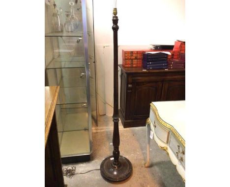 A floor lamp with turned reeded stem on dished base with beaded edge (160cm)
