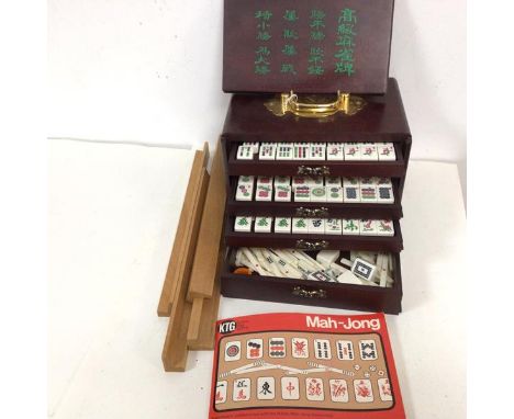 A boxed mah-jong set, travelling case with sliding top and five drawers to interior, complete with playing pieces (uncounted)