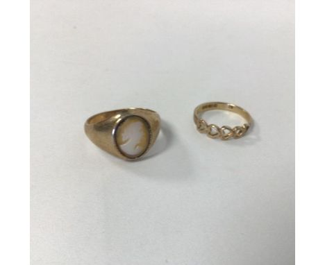 A 9ct gold signet style ring set shell cameo (L) and another ring in heart design (2) (combined: 3.7g)