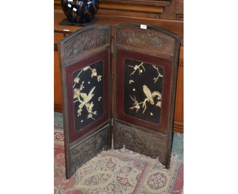 An oriental bifold firescreen panels decorated with carved bone birds and flora; a bible stand (2)