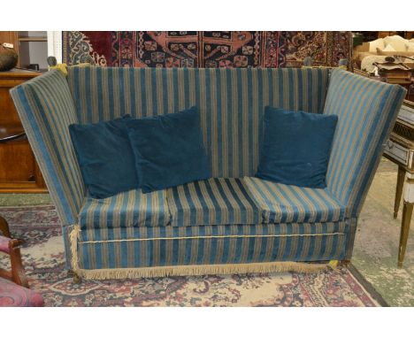 A Regency style high back double drop arm sofa.