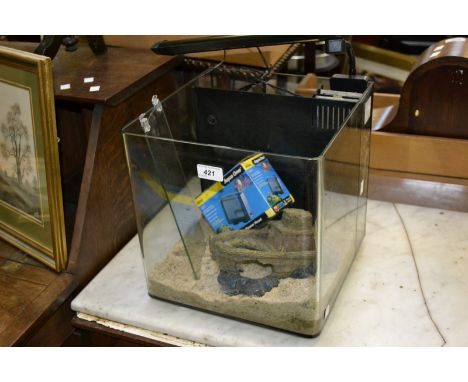 A cube style aquarium including Aqua One maxi 101 filter, light fittings and accessories.