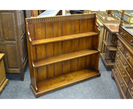 A Royal oak three shelf waterfall bookcase retailed by Arighi Bianchi. 107cm high x 119cm wide.