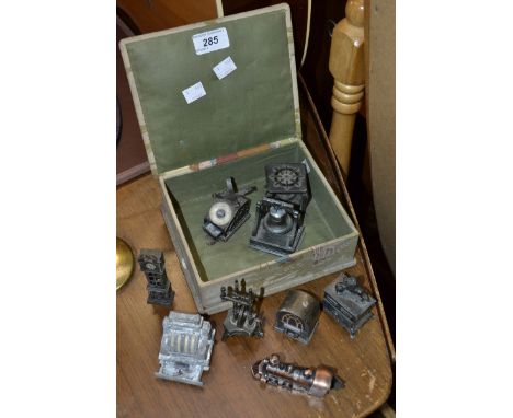 A collection of novelty pencil sharpeners in various forms including a longcase clock, a stove; a radio etc.