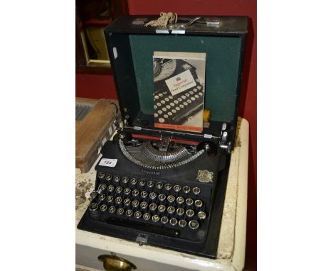 A wash board; a cased typewriter