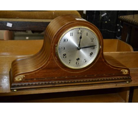 A mahogany Napoleon hat mantel clock, silvered dial, Arabic numerals, satinwood inlay.