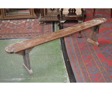 A stained pine kitchen bench,  rounded ends. 44cm high x 183cm long.