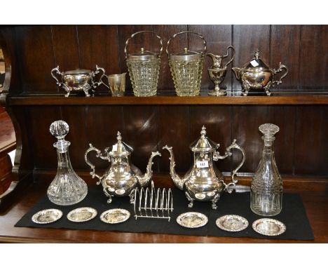 A four piece silver plated tea and coffee service, a pair of pressed glass ice buckets, decanters, etc