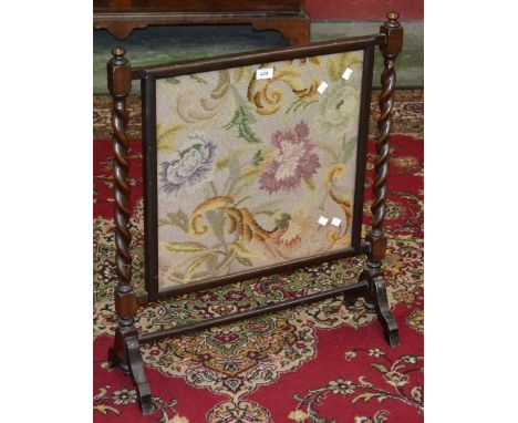 An oak barley twist firescreen with woolwork screen.