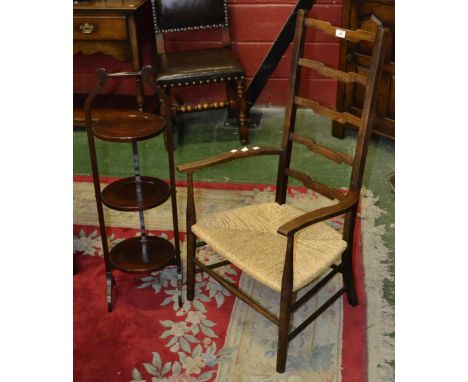 A Victorian mahogany three tier cake stand; a ladder back rush seat armchair (2)