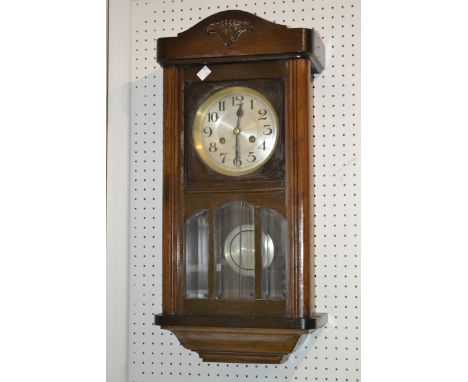 A 1940's oak wall clock