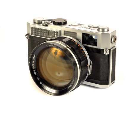 A Canon 7 Rangefinder Camera, chrome, serial no. 828088, with Canon f/0.95 50mm lens, black, serial no. 20240, body, G-VG, sh