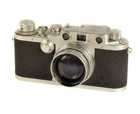 A Leica IIIc Rangefinder Camera, sharkskin covering, chrome, serial no. 464805, with Leitz Summitar f/2 50mm lens, chrome, se