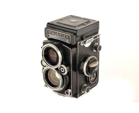 A Rolleiflex 2.8F TLR Camera, black, serial no. 2437093, with Carl Zeiss Planar f/2.8 80mm lens, serial no. 3837141, body, VG