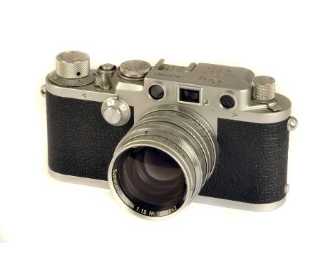 A Leica IIIf Rangefinder Camera, chrome, red dial, serial no. 637967, with Leitz Summarit f/1.5 50mm lens, chrome, serial no.