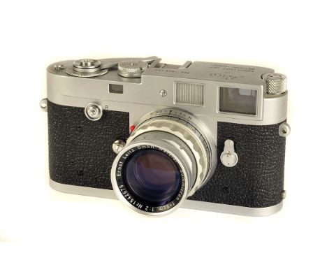 A Leica M2 Rangefinder Camera, chrome, serial no. 945486, with Leitz Summicron f/2 50mm lens, chrome, serial no. 1542675, bod