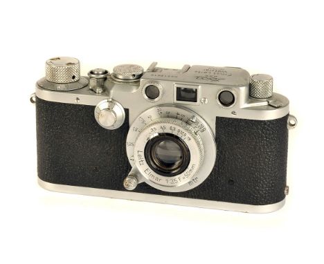 A Leica IIIf Rangefinder Camera, black dial, chrome, serial no. 512010, with Leitz Elmar f/3.5 50mm lens, chrome, body, F-G, 