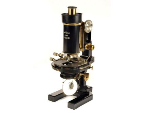 A Carl Zeiss lacquered and black enamelled Compound Monocular Microscope, Serial No. 32857, with horseshoe foot, Abbe condens