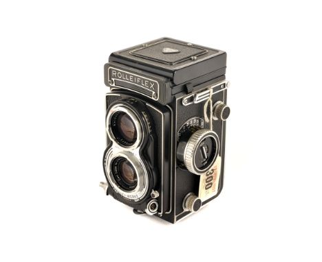 A Rolleiflex 3.5 T TLR Camera, black, serial no. 2245818, with Carl Zeiss Tessar f/3.5 75mm lens, serial no. 4786391, body, V