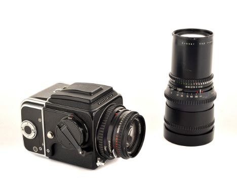 A Hasselblad 500C/M Camera, black/chrome, serial no. RS1238009, with Carl Zeiss Planar T* f/2.8 80mm lens, black, serial no. 