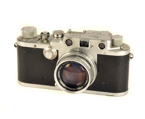 A Leica IIIc Rangefinder Camera, chrome, serial no. 409922, with Leitz Summicron f/2 50mm lens, chrome, serial no. 1278466, b