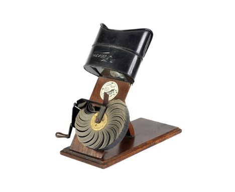 A Kinora Viewer, mounted on wooden-plinthm with manual hand crank drive, body, G, some corrosion to metal parts, optics, G-VG
