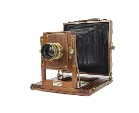 A McGhie Half Plate Mahogany Field Camera, with unmarked f/8 brass lens, body, VG, lacking ground glass, lens, F, heavy conde