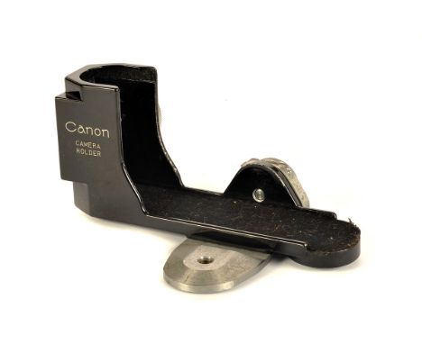 A Canon Camera Holder, black, with tripod foot adapter, in maker’s case