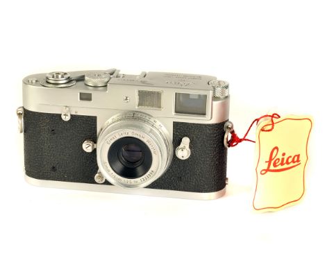 A Leica M2 Rangefinder Camera, chrome, serial no. 983813, with Leitz Elmar f/3.5 50mm lens, chrome, serial no. 1333998, body,