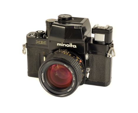 A Minolta XM SLR Camera, black, serial no. 2120875, with Rokkor MD f/1.2 50mm lens, black, serial no. 8007703, body, G, shutt