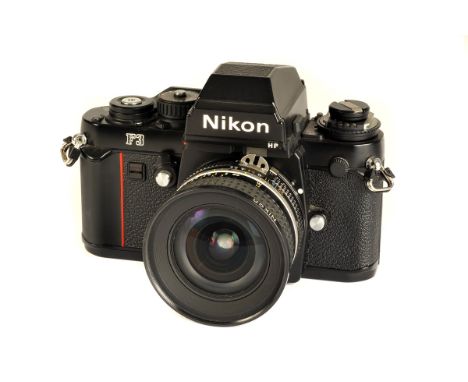 A Nikon F3 HP SLR Camera, black, serial no. 1934867, with AIS f/2.8 20mm lens, black, serial no. 247451, body, VG, shutter no