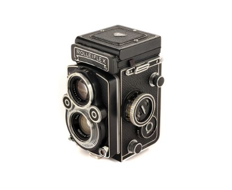 A Rolleiflex 3.5 F TLR Camera, black, serial no. 2298853, with Carl Zeiss Planar f/3.5 75mm lens, serial no. 4145389, body, V