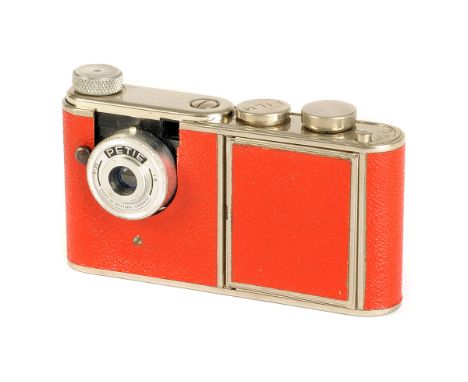 A Kunik Walter Petie Vanity Subminiature Camera, red, with f/1.9 25mm lens, body, G-VG, shutter working, lens, G, complete wi