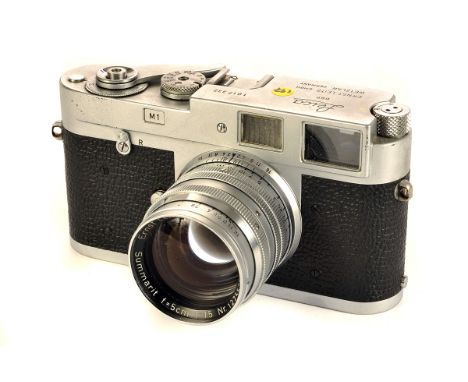 A Leica M1 Rangefinder Camera, chrome, serial no. 1017332, with Leitz Summarit f/1.5 50mm lens, chrome, serial no. 1275535, b