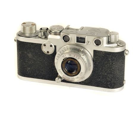 A Leica IIf Rangefinder Camera, red dial, chrome, serial no. 799138, with Leitz Elmar f/3.5 50mm lens, chrome, serial no. 671