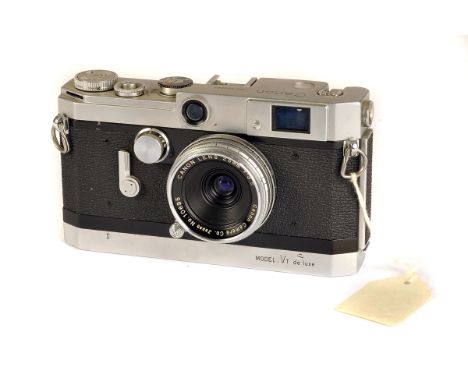 A Canon VT De Luxe Rangefinder Camera, chrome, serial no. 550665, with Canon f/3.5 25mm lens, chrome, serial no. 10695, body,