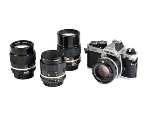 A Nikon FM2n SLR Camera, chrome, serial no. 8222737, with AIS f/1.4 50mm lens, black, serial no. 5741411, body, VG, shutter w