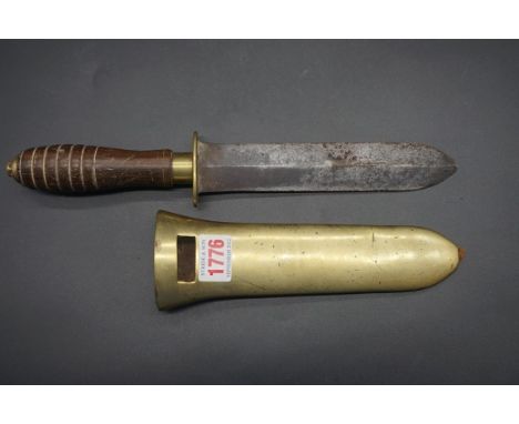 A vintage diver's knife and brass sheath, having 18.5cm blade, with turned hardwood handle.IF REQUESTING IN-HOUSE SHIPPING FO