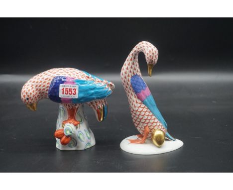 Two Herend figures, comprising: a large parrot, No.5001; 14cm high; and large goose, No.5936, 19cm high, each with red fish s