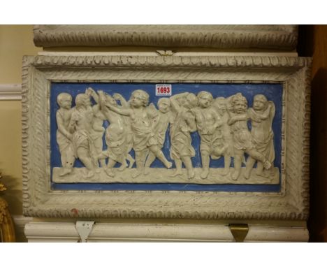 A large pair of 19th century Della Robbia rectangular plaques, each relief decorated with classical cherubs, 31.5 x 56cm.Not 