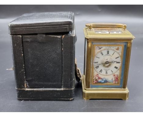 A good late 19th century brass and porcelain carriage clock, the painted dial inscribed 'Examd by Lund &amp; Blockley, 42 Pal