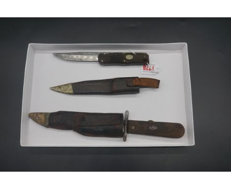 A Taylor Sheffield 'Real Knife Witness' folding knife and leather sheath, having 18cm blade with chequered wood grips; togeth