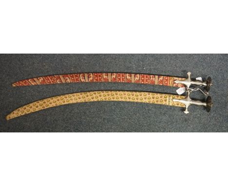 Two antique Indian Tulwars and scabbards. IN HOUSE SHIPPING IS NOT AVAILABLE ON THIS ITEM.   