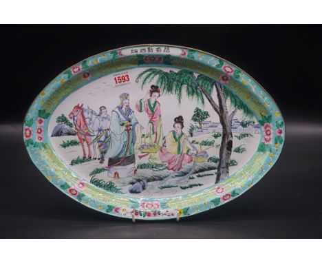A Chinese Canton enamel oval dish, 40.5cm wide.&nbsp; 